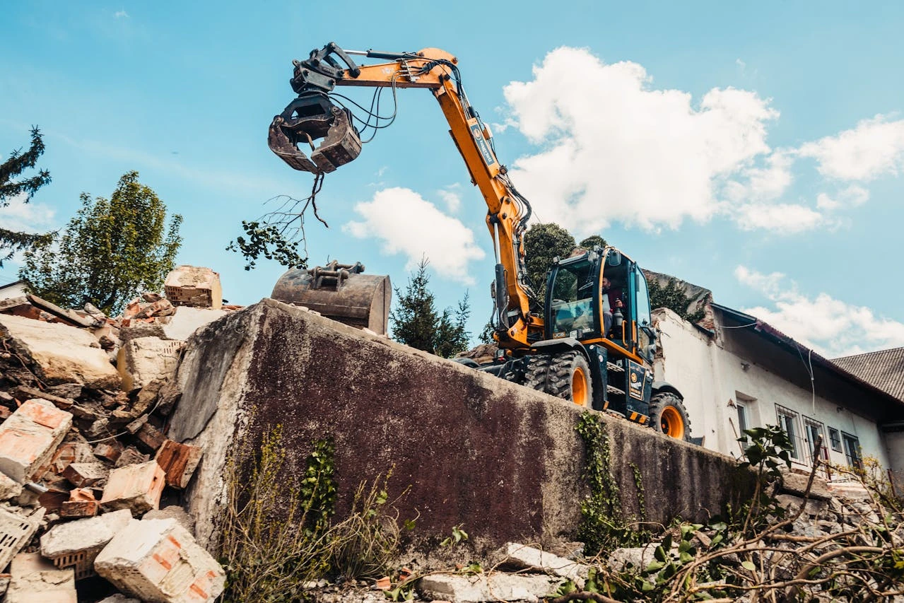 Heavy machinery performing commercial demolition and site excavation in Vernon, ensuring a clean and level lot for future Okanagan business development.